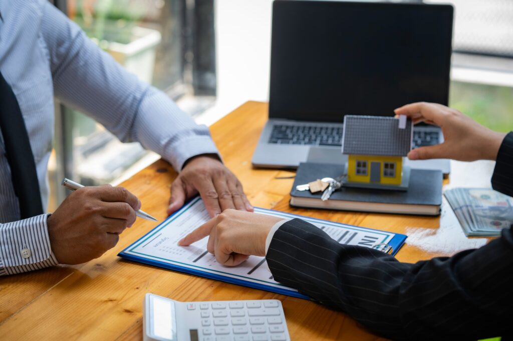 Insurance Agent Broker Man Holding Document And Present Pointing Showing An Insurance Policy Contrac